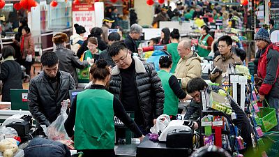 China consumers squeezed in 2018 as income gains slow, living costs rise