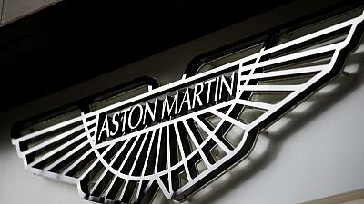 Carmaker Aston Martin's adjusted pre-tax profit falls