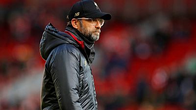Leaders Liverpool face derby test as title race heats up