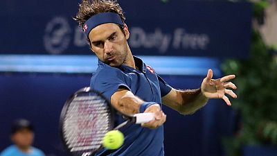 Federer fends off Fucsovics for Dubai semi-final spot