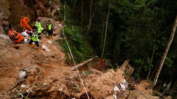 Indonesian rescuers amputate miner's leg to save him from collapsed mine