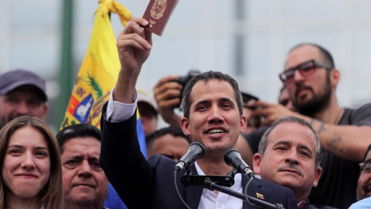 In jab at Maduro, Guaido makes triumphant return to Venezuela