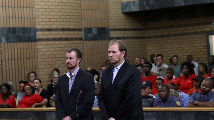 South African court jails two white farmers for killing black teenager