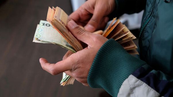 Debts pile up as rival Libyan governments struggle for power Debts pile up as rival Libyan governments struggle for power