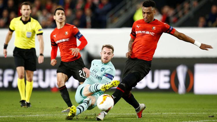 10-man Arsenal slump in Rennes, Sevilla held