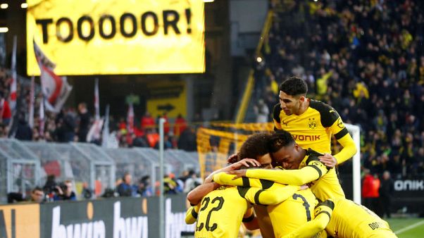 Dortmund drop to second despite 3-1 win over Stuttgart Dortmund drop to second despite 3-1 win over Stuttgart