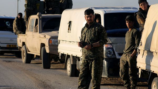With shrouded faces, Islamic State fighters stand guard over final enclave With shrouded faces, Islamic State fighters stand guard over final enclave