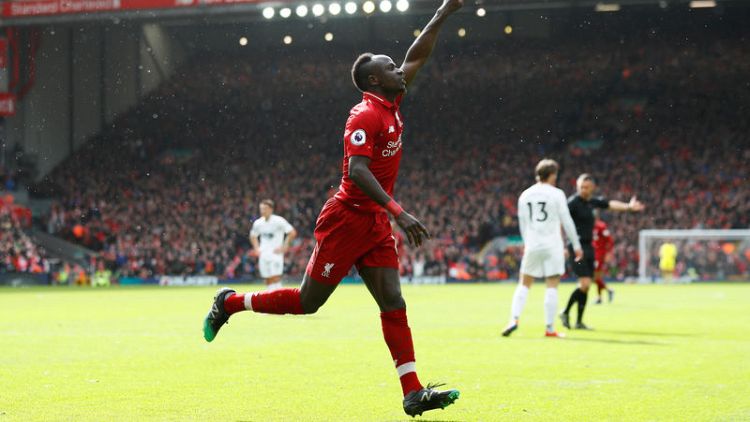 Firmino and Mane sink Burnley to keep Liverpool in the race