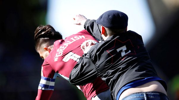 Pitch invader punches Villa's Grealish in derby win at Birmingham Pitch invader punches Villa's Grealish in derby win at Birmingham