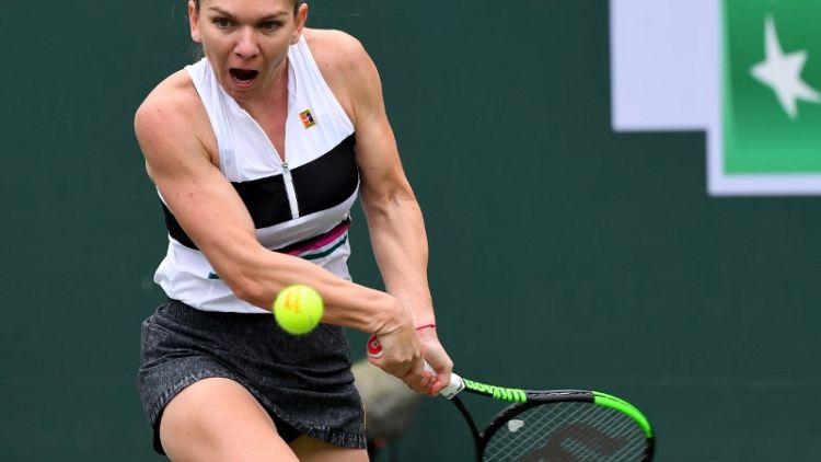 Halep claims tough win over qualifier Kozlova