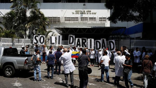 Doctors pray for sick as blackout batters Venezuelan hospitals Doctors pray for sick as blackout batters Venezuelan hospitals
