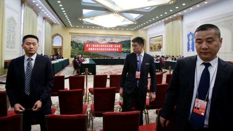 China says Xinjiang has 'boarding schools', not 'concentration camps'