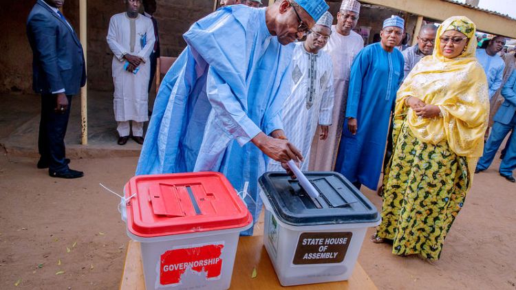 Nigeria's ruling party takes close lead in governor elections, but balance could tip