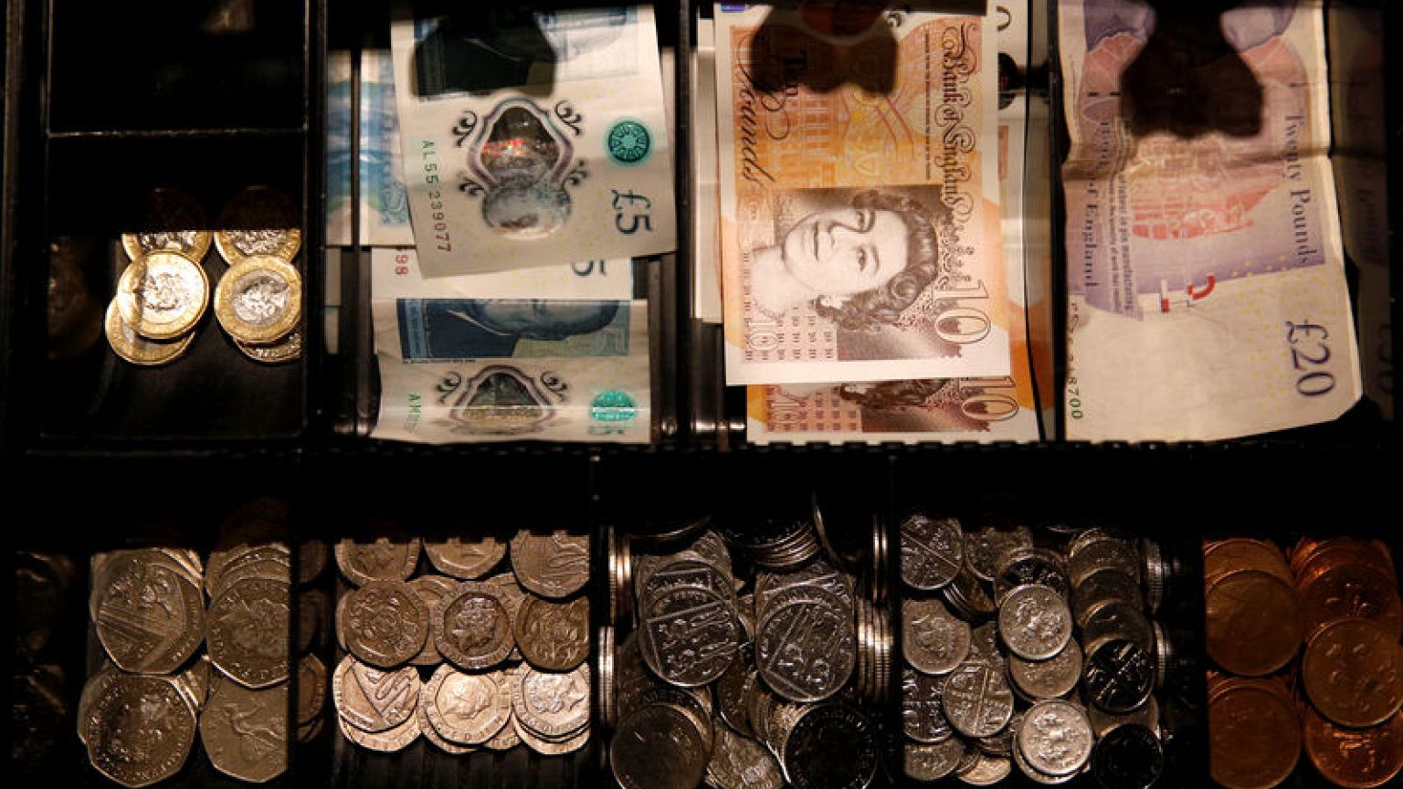 Pound edges up after May's Brexit defeat, more volatility expected