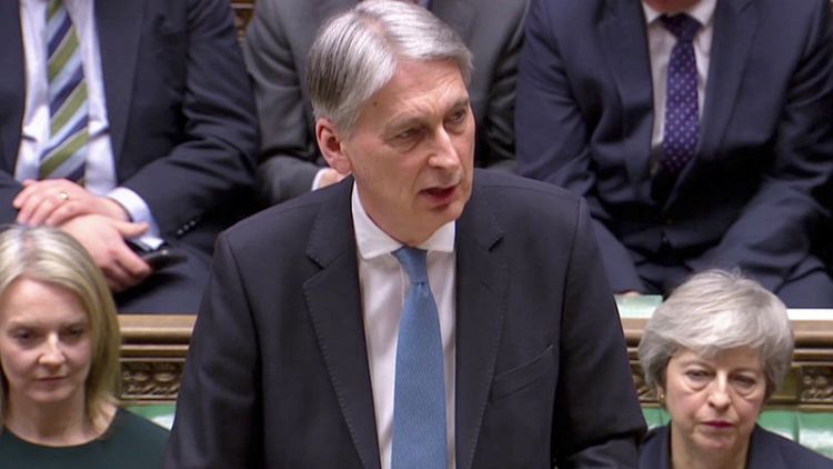 Hammond offers more spending, lower taxes if a Brexit deal is done