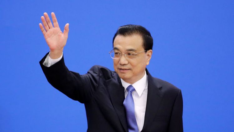 China will follow through on new investment law, premier pledges