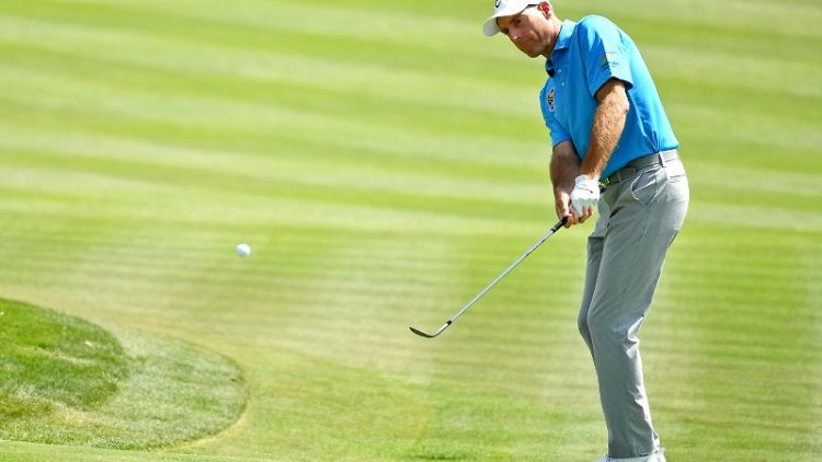 Golf - Veteran Furyk shoots 64 to take 36-hole clubhouse lead at Players