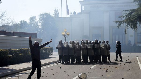 Albanian police disperse protesters with tear gas and water cannon Albanian police disperse protesters with tear gas and water cannon