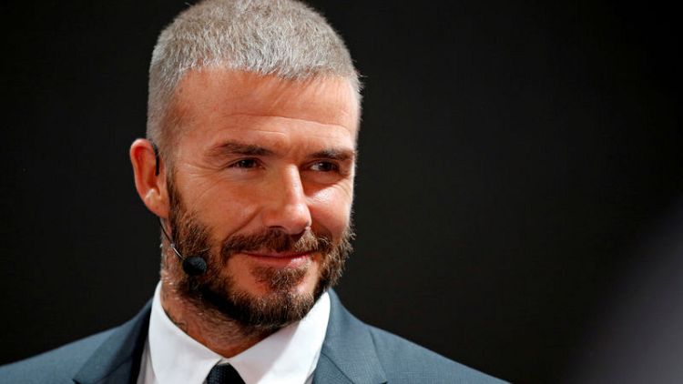 Beckham backs Solskjaer, says fans want him to continue