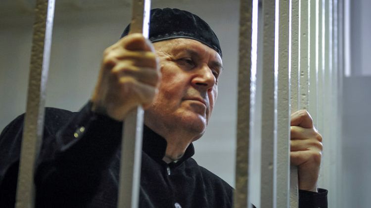 Court in Chechnya sentences rights activist to four years in penal colony