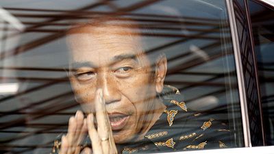 Indonesian president's lead over election rival cut in new survey Indonesian president's lead over election rival cut in new survey