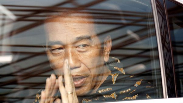 Indonesian president's lead over election rival cut in new survey Indonesian president's lead over election rival cut in new survey