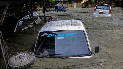 Indonesia's Papua set for mass burial as flood death toll tops 100 Indonesia's Papua set for mass burial as flood death toll tops 100