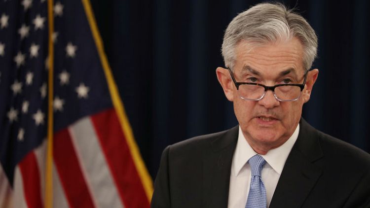 Fed sees no rate hikes in 2019, plans balance sheet reduction slowdown