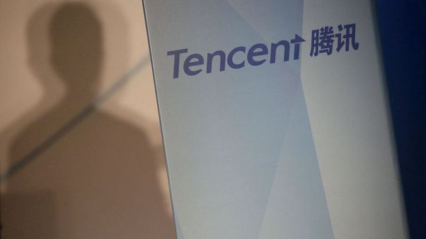 Tencent posts worst ever profit drop on gaming freeze, one-off charges Tencent posts worst ever profit drop on gaming freeze, one-off charges