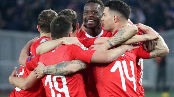Swiss survive difficult first half to beat Georgia Swiss survive difficult first half to beat Georgia