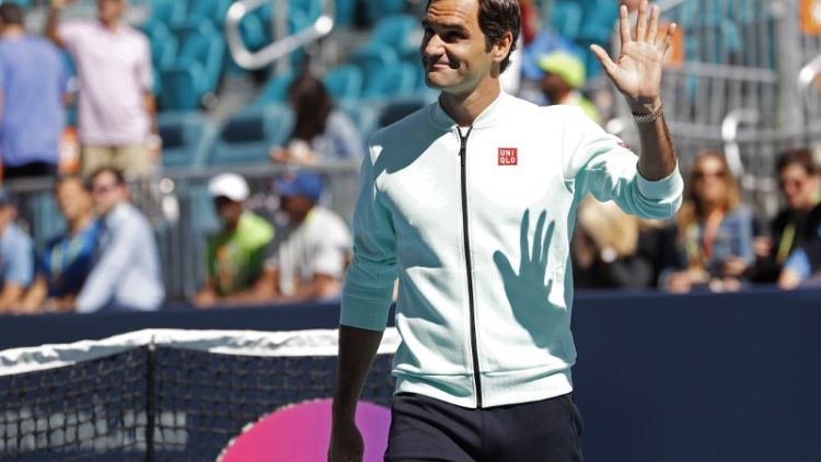 Federer fights back to beat Albot in Miami