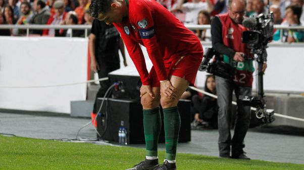 Serbia hold Portugal after Ronaldo suffers first-half injury Serbia hold Portugal after Ronaldo suffers first-half injury