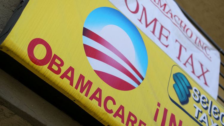 Trump administration steps up Obamacare attack, asks court to overturn law
