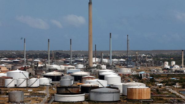 Exclusive: U.S. orders foreign firms to further cut down on oil trades with Venezuela Exclusive: U.S. orders foreign firms to further cut down on oil trades with Venezuela