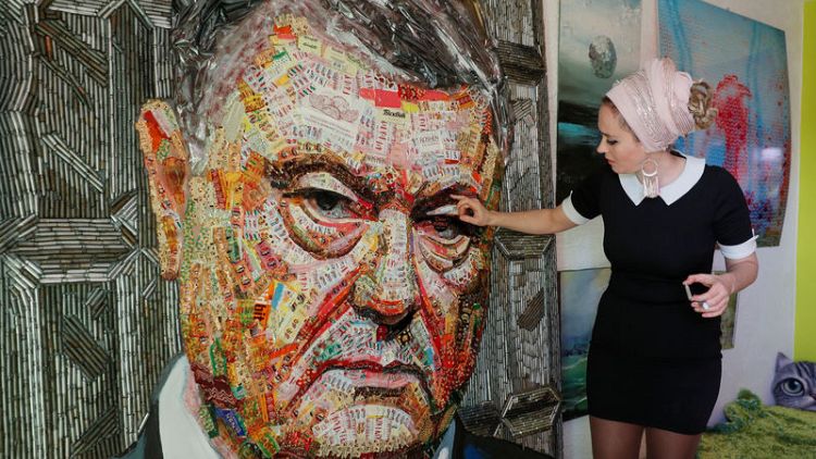 Artists use Ukraine president's candy wrappers for critical portrait