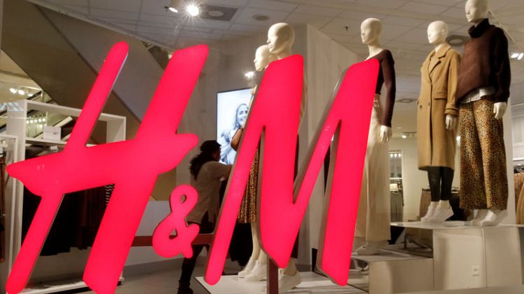 H&M profit falls less than expected after it curbs discounts