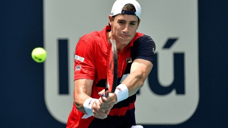 Isner fights back to beat teen Auger-Aliassime in Miami semis