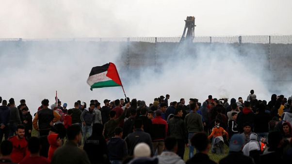 Palestinians mass at Gaza border to mark protest anniversary Palestinians mass at Gaza border to mark protest anniversary