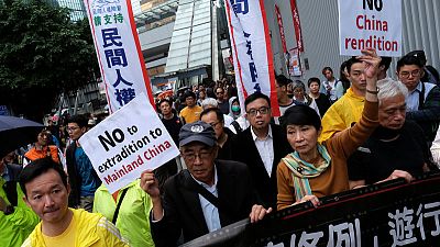 Thousands march in Hong Kong over proposed extradition law changes Thousands march in Hong Kong over proposed extradition law changes