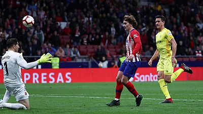 Late strikes from Godin and Griezmann keep Atletico in title chase Late strikes from Godin and Griezmann keep Atletico in title chase