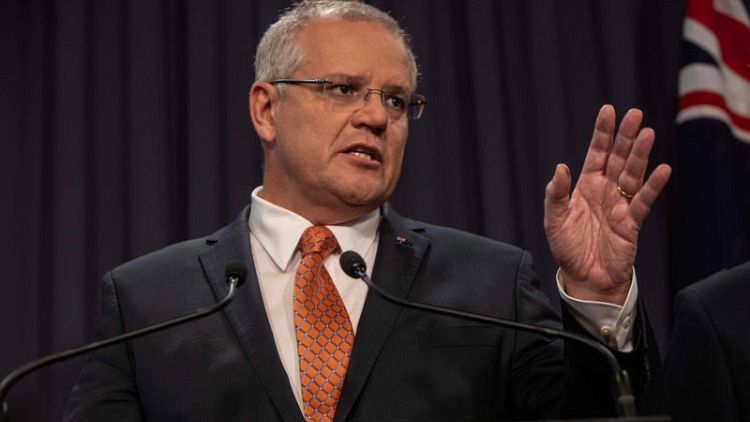 On election footing, Australia government extends budget welfare