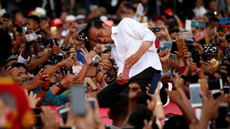 With holograms and breakdancing, a battle for Indonesia's youth vote