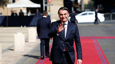 Brazil's Bolsonaro warms to old-style politics to push pension bill Brazil's Bolsonaro warms to old-style politics to push pension bill