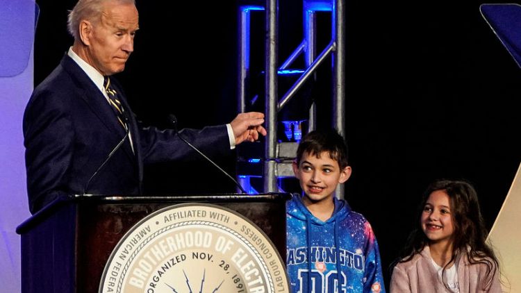 Amid complaints about unwanted touching, Biden jokes he got 'permission' to hug