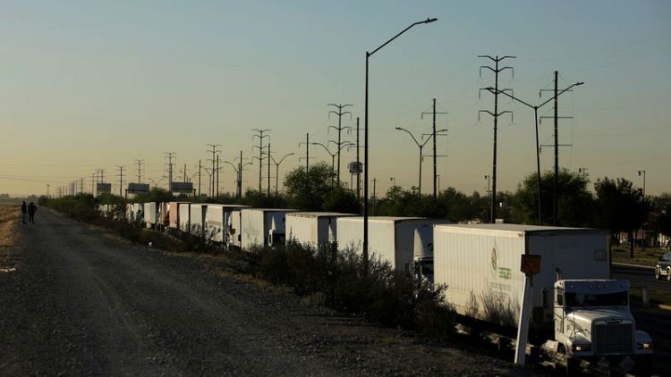 Delays at U.S.-Mexico border crossing hits autos, trucks still lining up