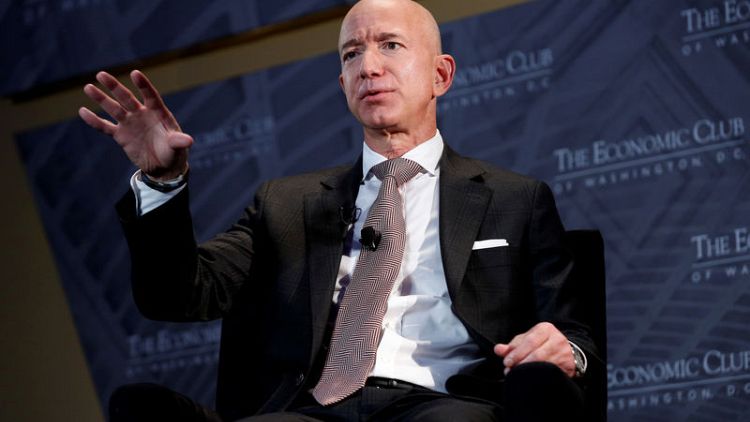 Amazon's Bezos challenges retail rivals to raise minimum wages