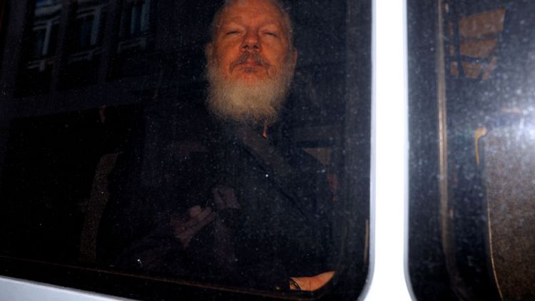 Out of the embassy, straight into custody: Assange's court hearing