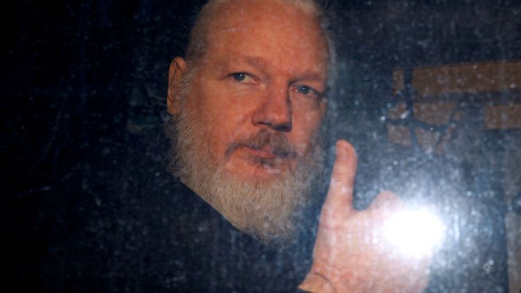 Ecuador holding Swedish programmer linked to Assange in custody