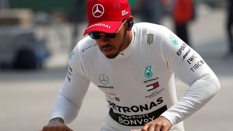 Motor racing - Hamilton baffled by his car's behaviour