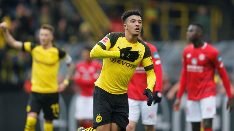 Sancho double sends nervous Dortmund back on top